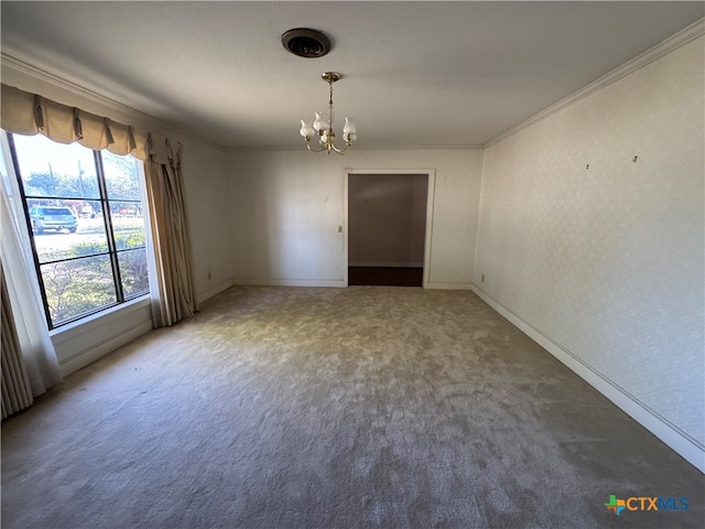 unfurnished room with carpet flooring, a notable chandelier, and ornamental molding