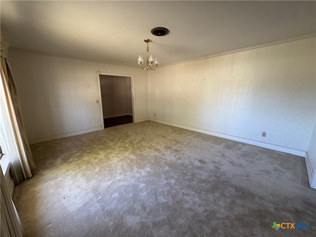 unfurnished room with crown molding, carpet, and an inviting chandelier