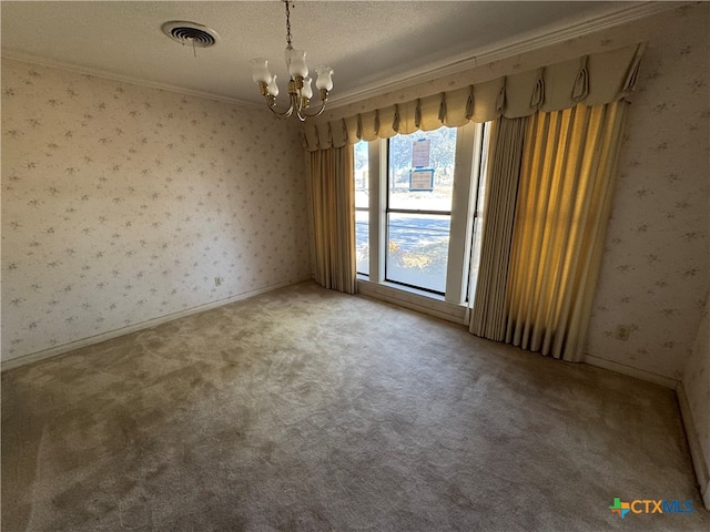 empty room featuring carpet flooring, crown molding, a textured ceiling, and an inviting chandelier