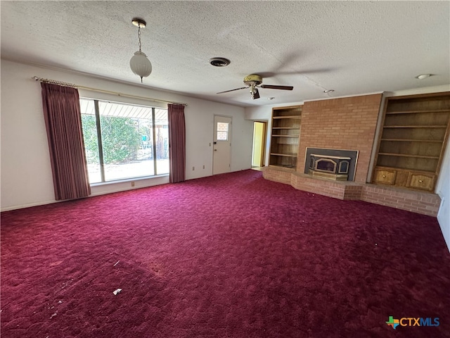 unfurnished living room featuring ceiling fan, carpet, and a textured ceiling