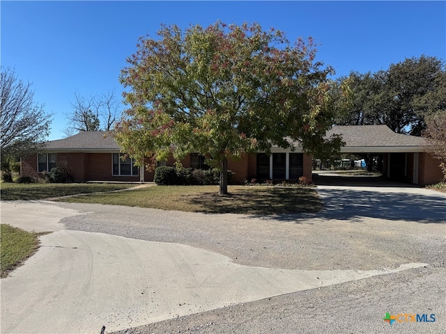 view of front facade with a carport