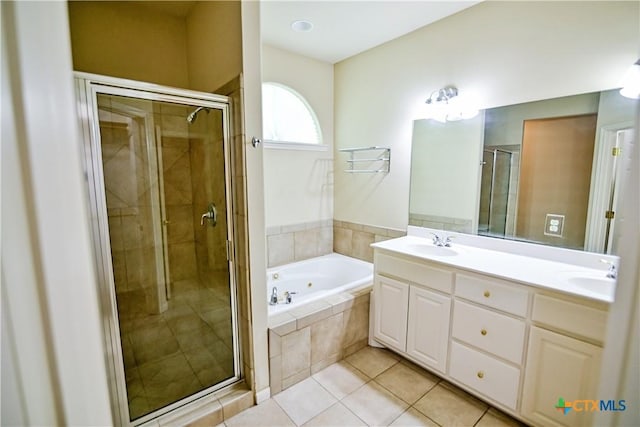 1802 N Vine St, Victoria, TX 77901 - full bathroom featuring a whirlpool tub, a shower stall, and double vanity