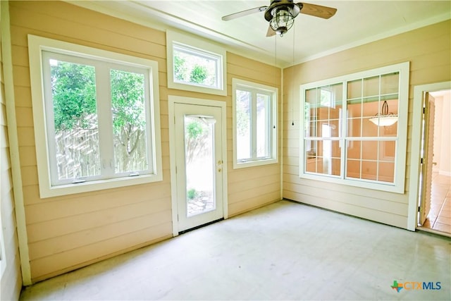1802 N Vine St, Victoria, TX 77901 - doorway to outside with a ceiling fan and wood walls