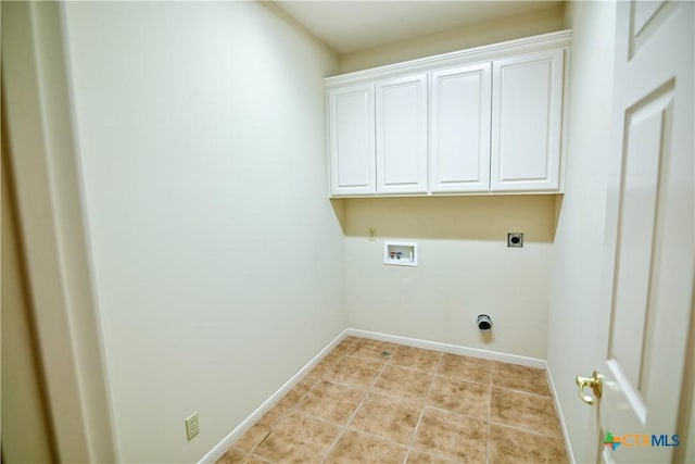 1802 N Vine St, Victoria, TX 77901 - laundry room featuring electric dryer hookup, hookup for a washing machine, cabinet space, and light tile patterned floors