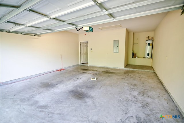 1802 N Vine St, Victoria, TX 77901 - garage featuring water heater, electric panel, and a garage door opener
