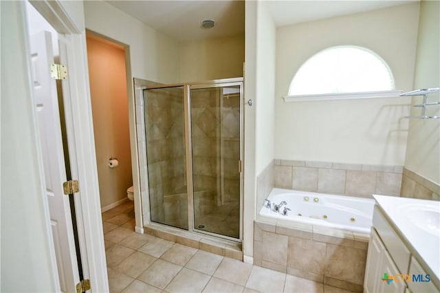 1802 N Vine St, Victoria, TX 77901 - full bath with a whirlpool tub, a shower stall, tile patterned flooring, and vanity