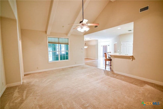 1802 N Vine St, Victoria, TX 77901 - unfurnished room with light colored carpet, a ceiling fan, beam ceiling, and high vaulted ceiling