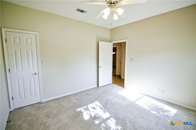 1802 N Vine St, Victoria, TX 77901 - unfurnished bedroom featuring carpet floors and a ceiling fan