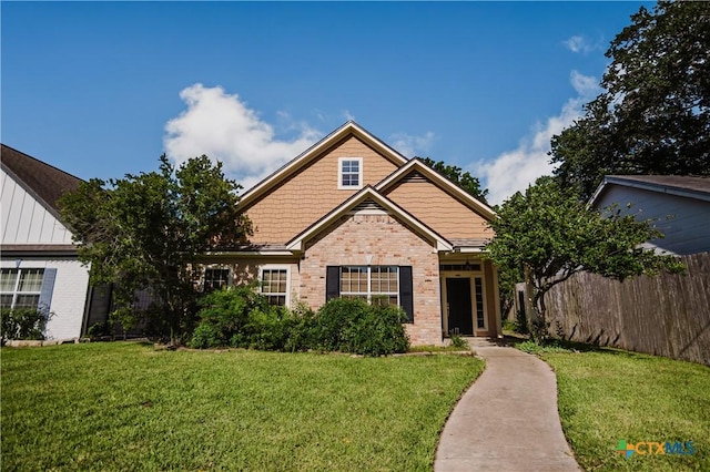 1802 N Vine St, Victoria, TX 77901 - view of front facade featuring brick siding and board and batten siding