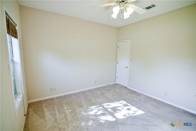 1802 N Vine St, Victoria, TX 77901 - empty room featuring carpet floors and a ceiling fan