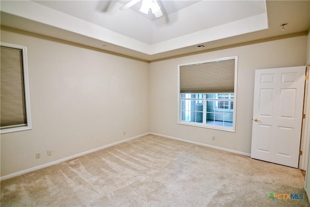 1802 N Vine St, Victoria, TX 77901 - carpeted empty room with ceiling fan and a tray ceiling