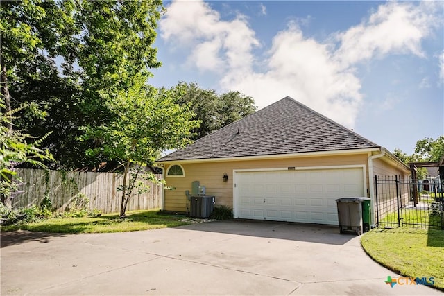 1802 N Vine St, Victoria, TX 77901 - view of property exterior featuring a shingled roof and a cooling unit