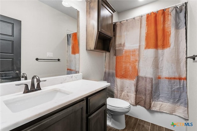 8306 Callahan Dr, Killeen, TX 76542 - full bath featuring vanity, wood finished floors, and shower / tub combo with curtain