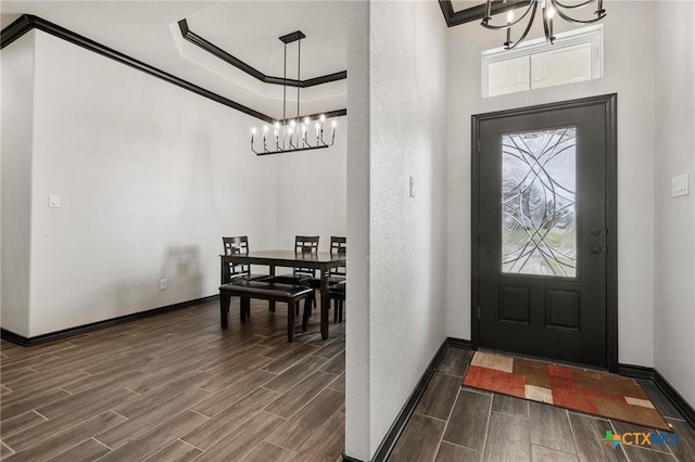 8306 Callahan Dr, Killeen, TX 76542 - entryway featuring a chandelier, dark wood-type flooring, healthy amount of natural light, and ornamental molding