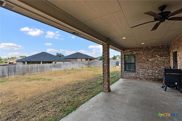 8306 Callahan Dr, Killeen, TX 76542 - fenced backyard featuring ceiling fan and a patio area