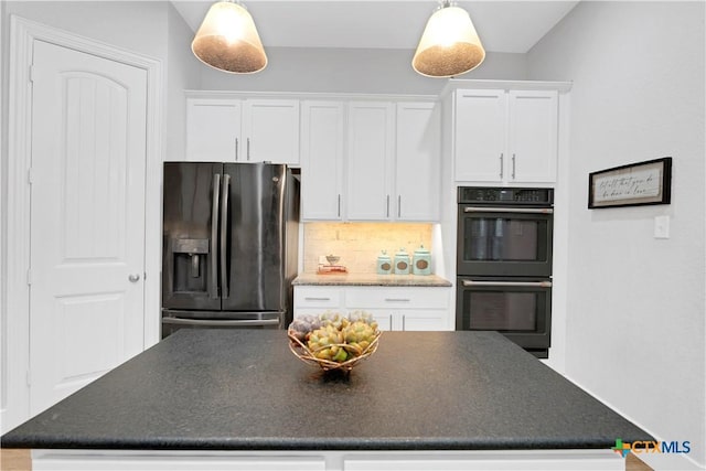 kitchen with a center island, black appliances, backsplash, white cabinetry, and dark countertops