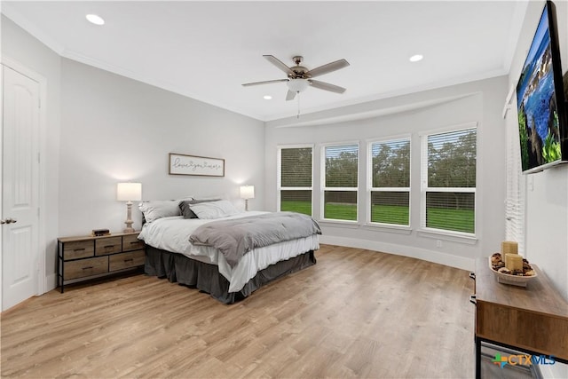 bedroom featuring recessed lighting, ornamental molding, a ceiling fan, and light wood-style floors