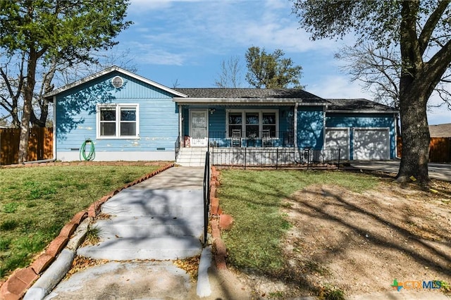 ranch-style house with a porch, an attached garage, fence, and a front lawn