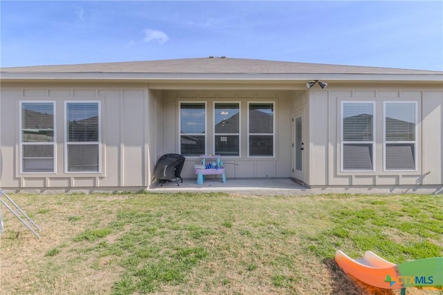 707 Winscott Ave, Temple, TX 76502 - back of house featuring board and batten siding, a patio, and a yard