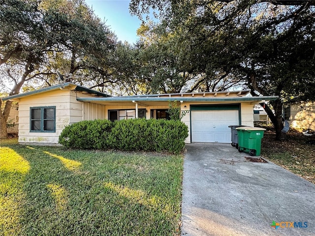 ranch-style house with a garage and a front yard