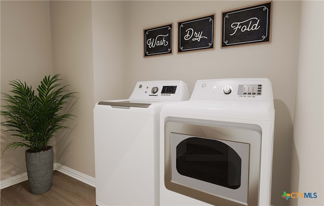 3812 Keller Rd, Temple, TX 76504 - laundry room featuring washing machine and dryer, wood finished floors, baseboards, and laundry area