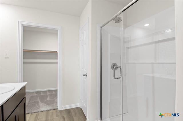 3812 Keller Rd, Temple, TX 76504 - full bath with a stall shower, a spacious closet, vanity, and wood finished floors