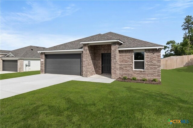 3812 Keller Rd, Temple, TX 76504 - view of front of property with a garage, driveway, brick siding, and a shingled roof