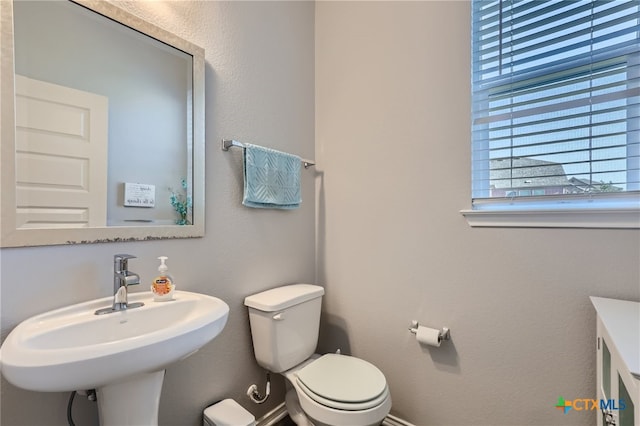 bathroom with sink and toilet