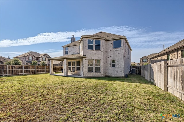 back of house with a yard, a patio, and cooling unit