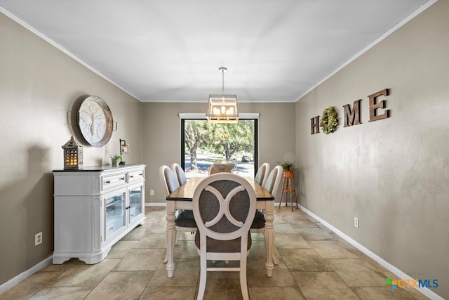 dining area featuring a chandelier and ornamental molding