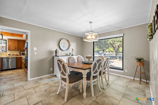 dining area with ornamental molding and a notable chandelier