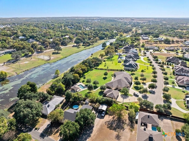 birds eye view of property with a residential view and a water view