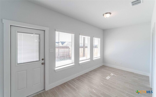 513 Lina Way, Seguin, TX 78155 - foyer featuring baseboards and light wood-style floors
