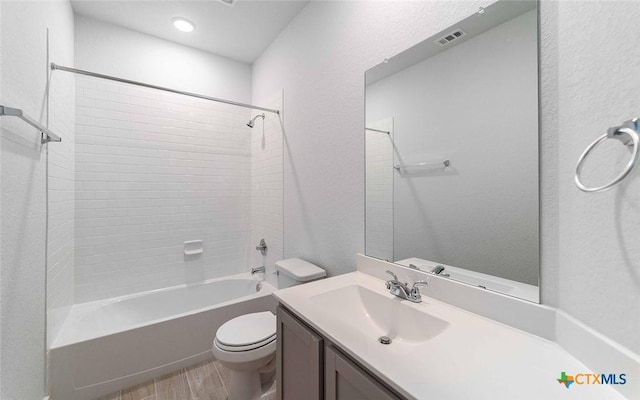 513 Lina Way, Seguin, TX 78155 - bathroom featuring toilet, vanity, shower / bath combination, and wood finished floors