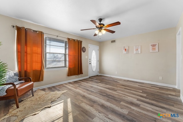 entrance foyer featuring wood-type flooring and ceiling fan