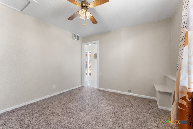 empty room with carpet floors and ceiling fan