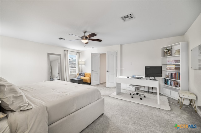 bedroom with visible vents, ceiling fan, and carpet flooring