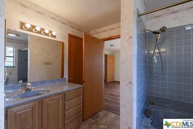 121 S Scenic Loop, Canyon Lake, TX 78133 - full bath with a textured ceiling, vanity, shower / bathtub combination, and wallpapered walls