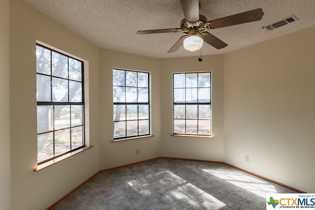 121 S Scenic Loop, Canyon Lake, TX 78133 - empty room with carpet flooring, a textured ceiling, ceiling fan, and baseboards