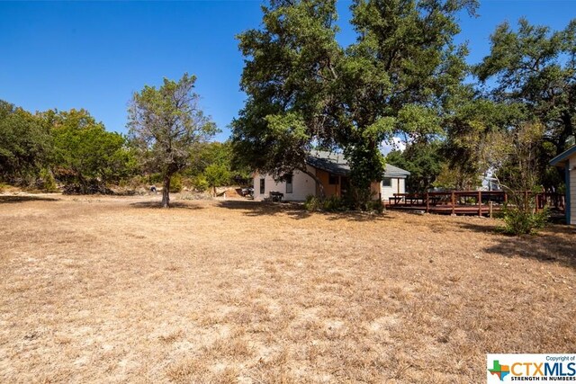 121 S Scenic Loop, Canyon Lake, TX 78133 - view of yard with a deck