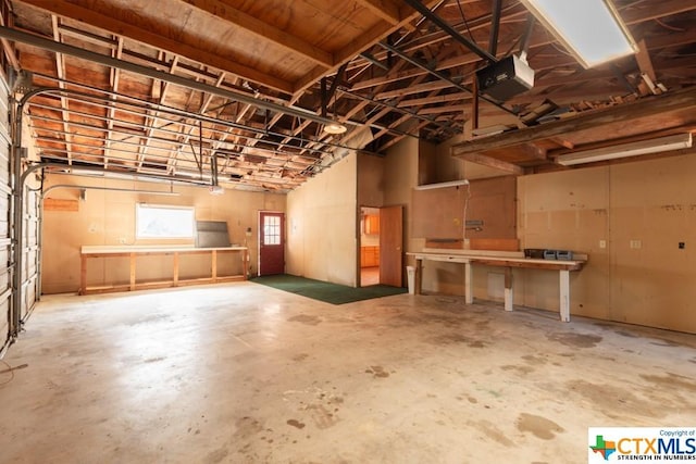 121 S Scenic Loop, Canyon Lake, TX 78133 - garage featuring a garage door opener