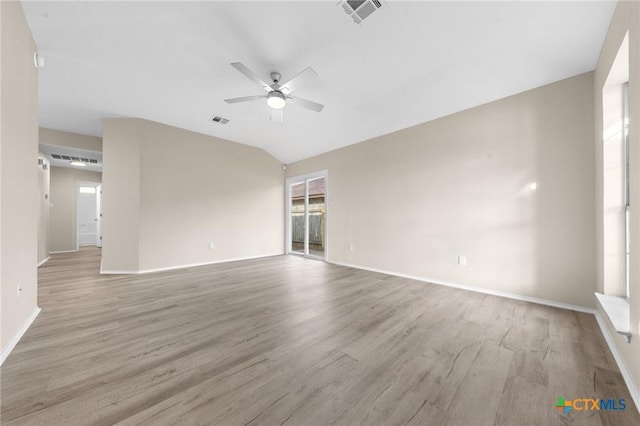 empty room featuring light wood finished floors, visible vents, and a ceiling fan