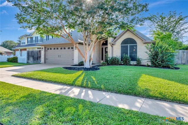 105 Legend Dr, Victoria, TX 77904 - view of front of house featuring an attached garage and concrete driveway