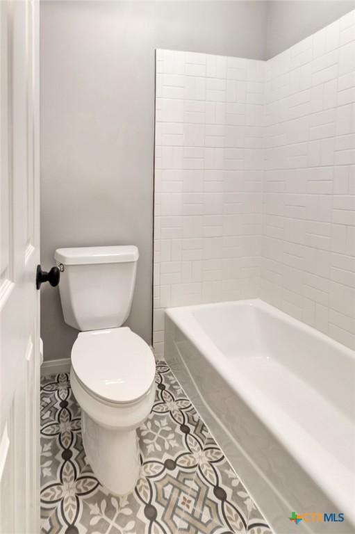 105 Legend Dr, Victoria, TX 77904 - bathroom featuring toilet, tile patterned floors, and baseboards