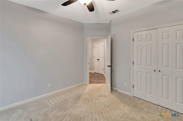 105 Legend Dr, Victoria, TX 77904 - unfurnished bedroom with light carpet, baseboards, ceiling fan, and a closet