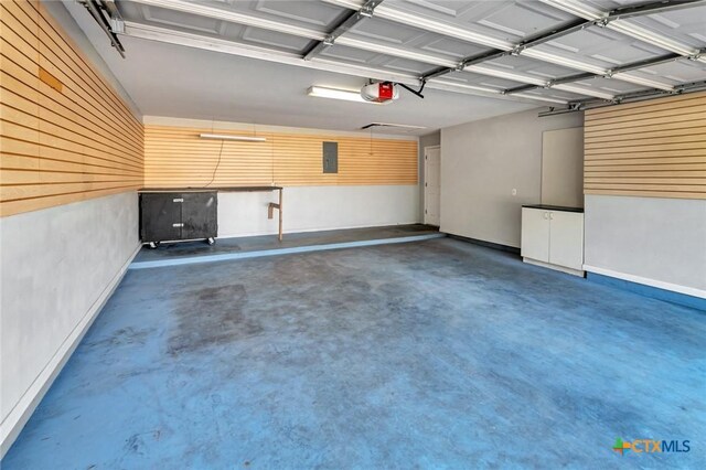 105 Legend Dr, Victoria, TX 77904 - garage with a garage door opener and baseboards