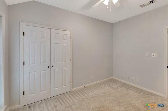 105 Legend Dr, Victoria, TX 77904 - unfurnished bedroom featuring carpet flooring, baseboards, a closet, and a ceiling fan