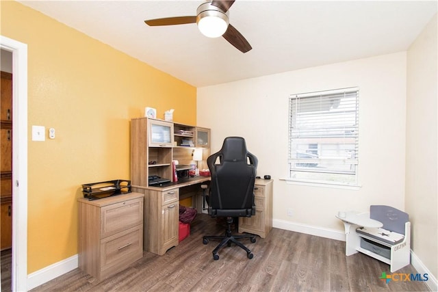 office space with wood finished floors, baseboards, and ceiling fan