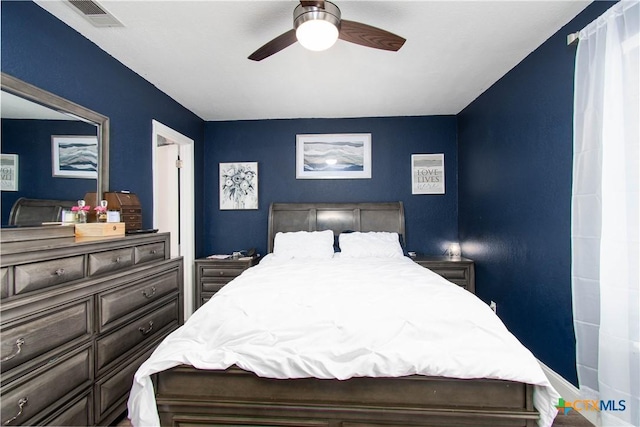 bedroom with visible vents and ceiling fan