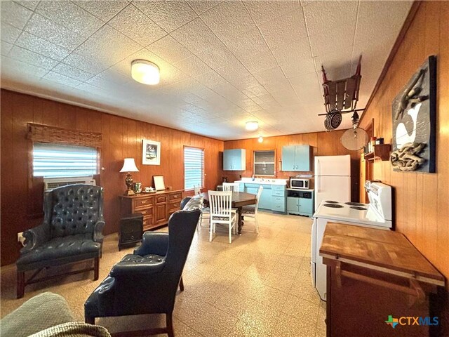 living room with wood walls